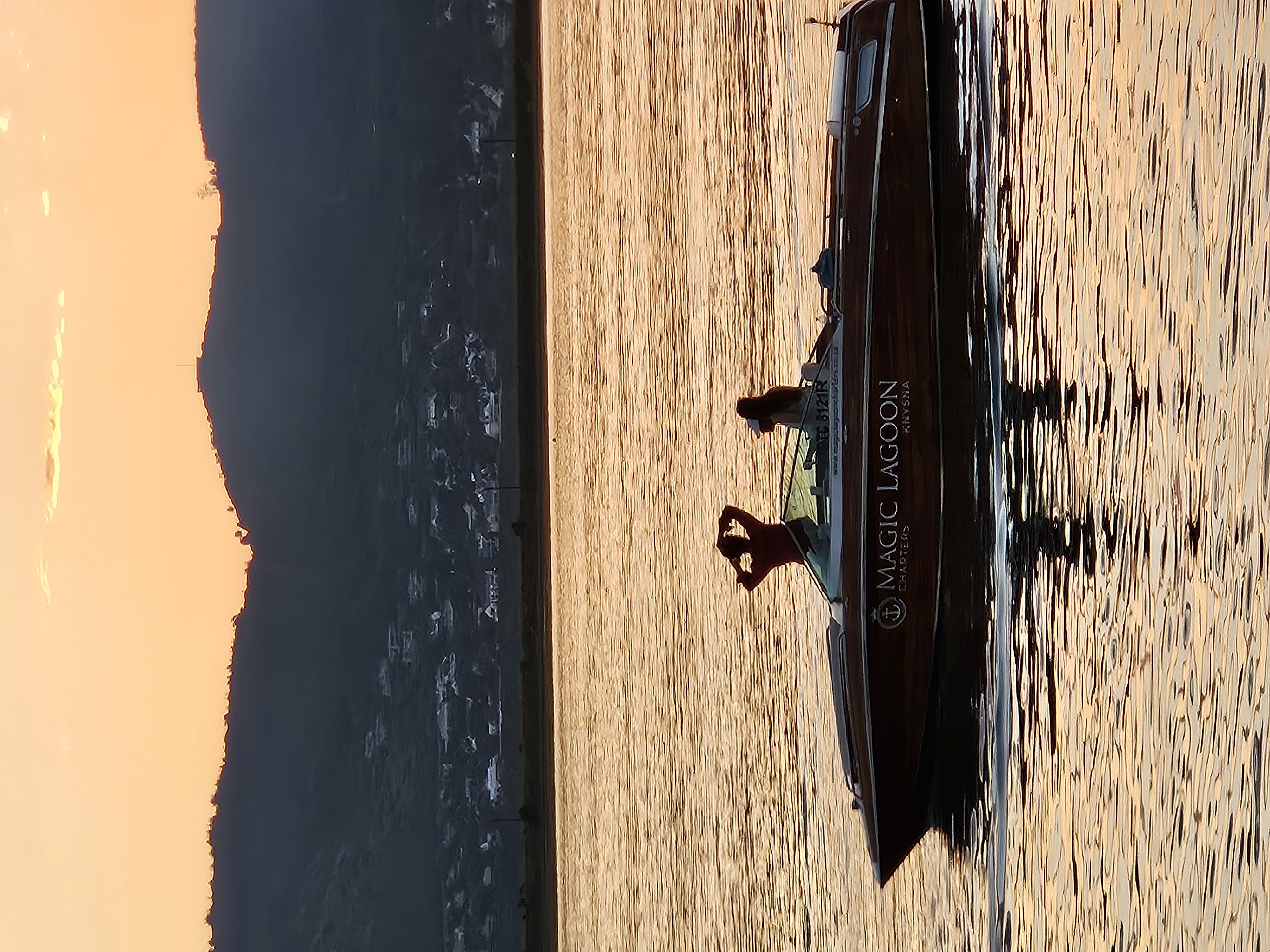 Pamela boat cruising on the Knysna Lagoon at golden hour — premium sunset cruise